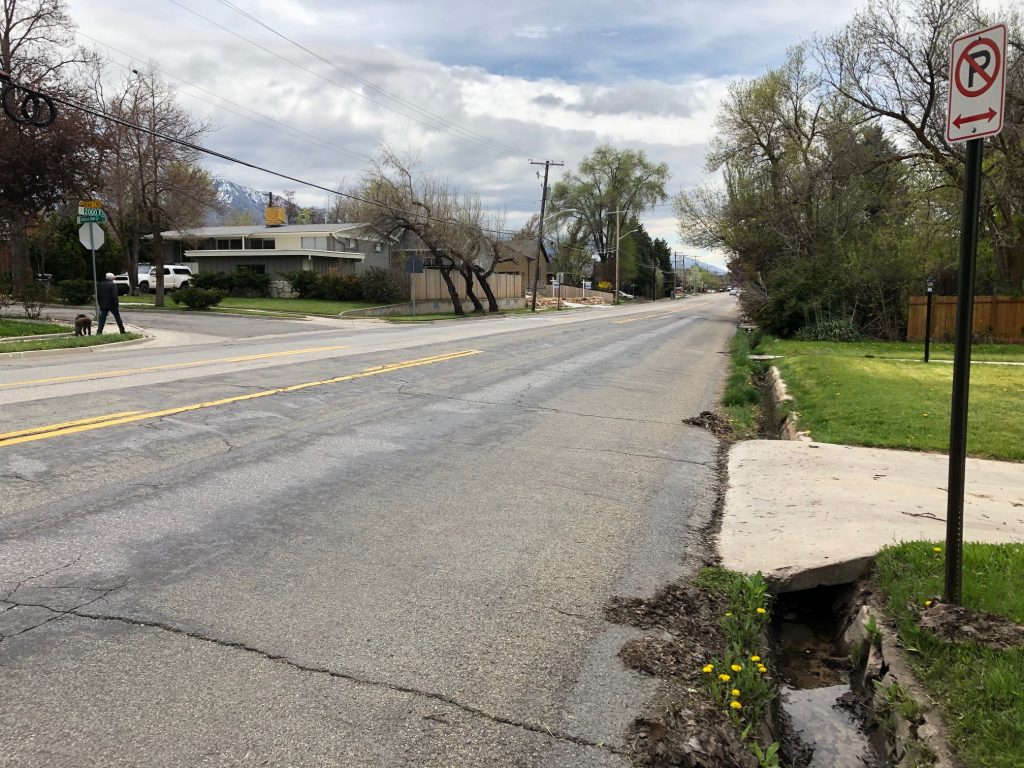 Deteriorated pavement on 2000 East prior to the reconstruction project.