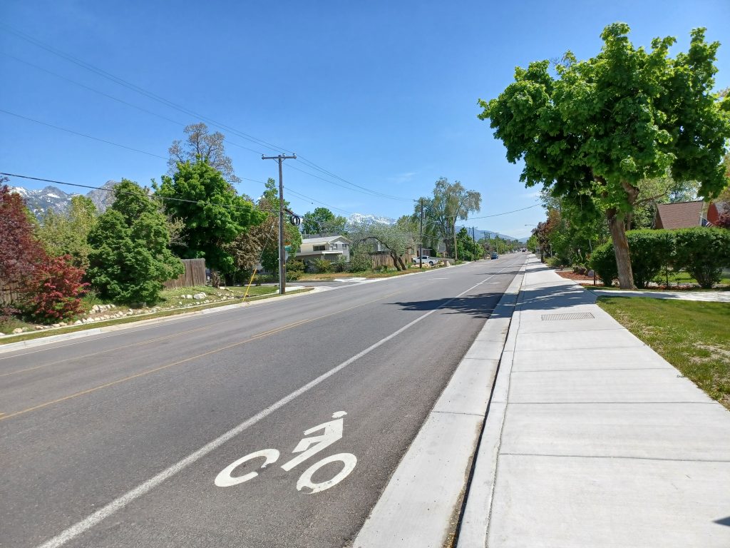 Fresh bike lane and pavement following the 2000 East reconstruction project.