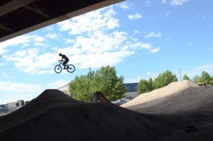 Biker riding the 9 Line dirt jumps.