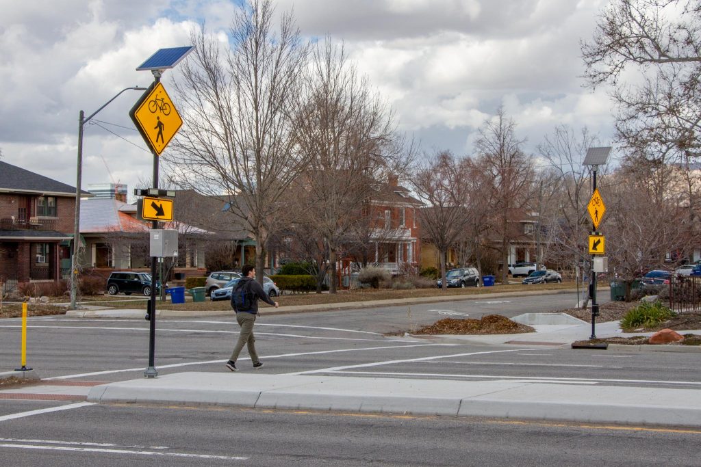 Person crossing 800 South on the 600 East neighborhood byway.