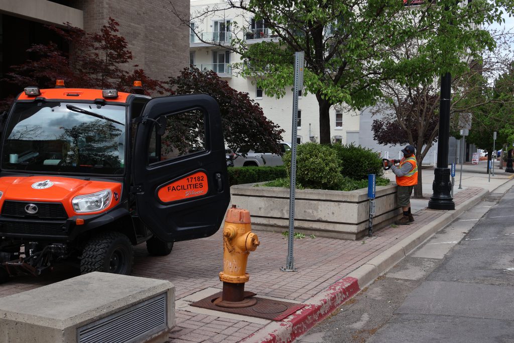 City employee performing landscaping duties in downtown Salt Lake City.