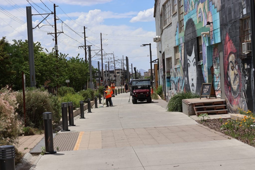 City employee performing beautification duties along the S-line.