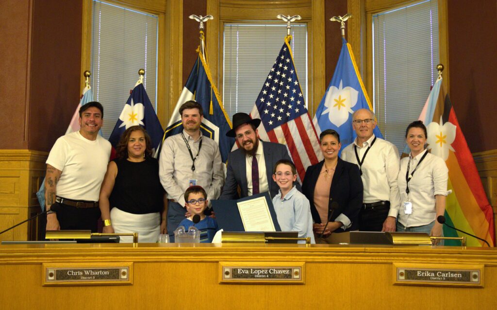 Council members with community members recognizing Education and Sharing Day.