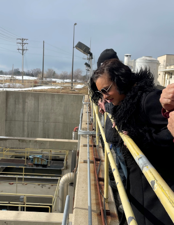 District 1 Council Member Victoria Petro looking over a railing at the water reclamation facility