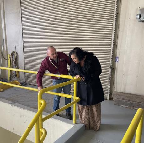 A man from the water reclamation facility explaining the facility to Council Member Petro