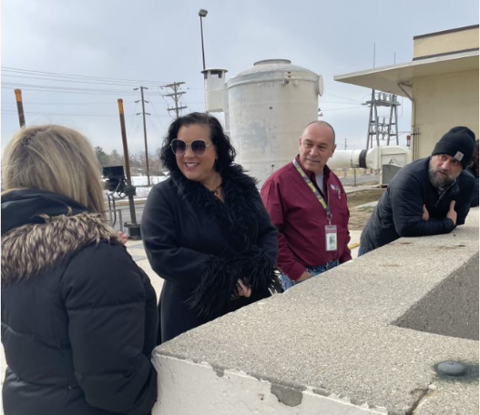 Council Member Petro talking with others at the water reclamation facility.