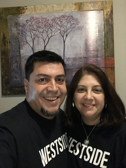 Westside residents, Domingo and Cindy, wearing their WESTSIDE shirts