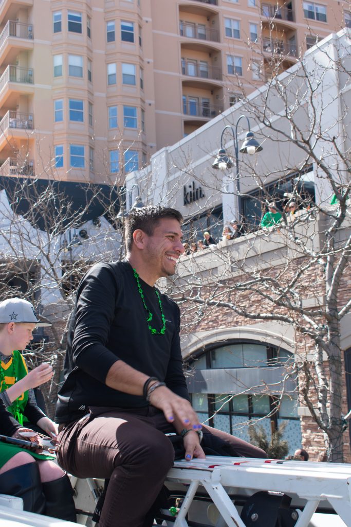 Council Member Alejandro Puy on top of a fire truck at the 46th annual St. Patrick's Day Parade.