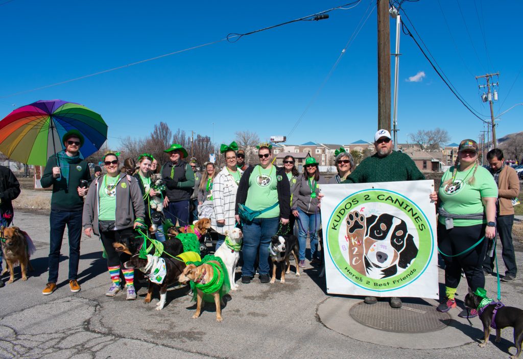 District 3 Council Member Chris Wharton posing with Kudos 2 Canines at the parade.
