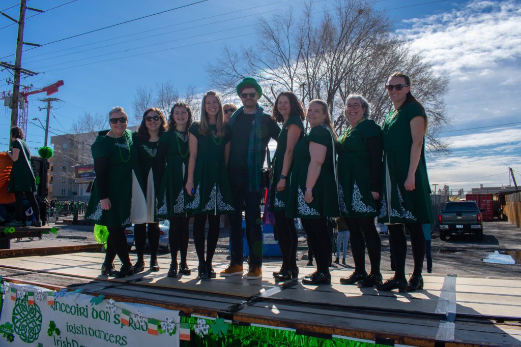 District 3 Council Member Chris Wharton posing with Irish dancers at the parade.