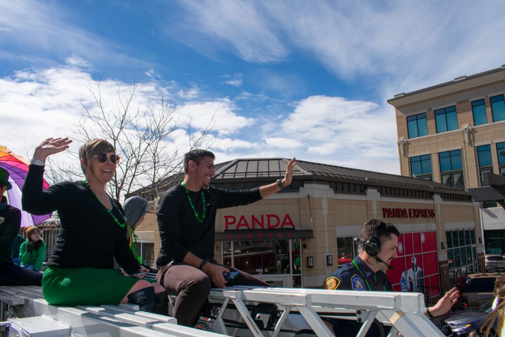 Council Member Alejandro Puy and other Salt Lake City Council Members waving at the people watching the parade.