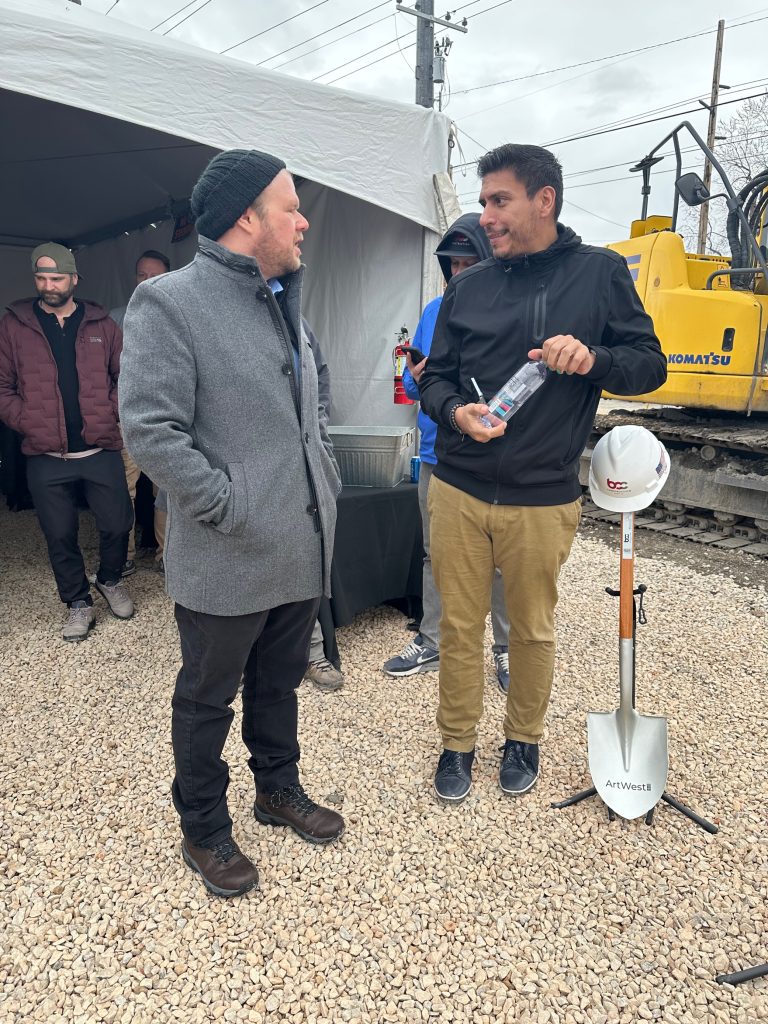 Council Member Puy talking with another person that attended the groundbreaking.