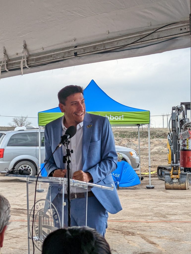 Council Member Alejandro Puy speaking at the groundbreaking ceremony for The Other Side Village.