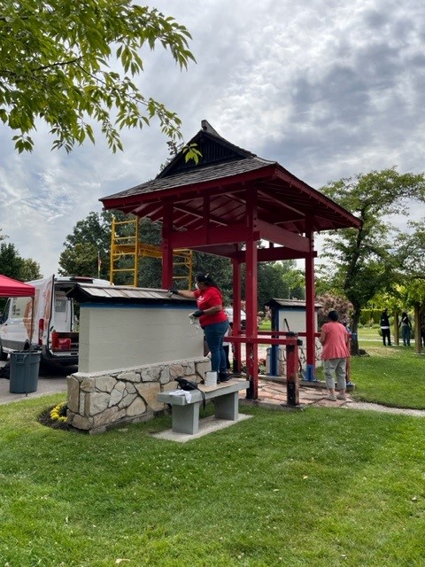 People working on the main gate to the Japan Gardens.