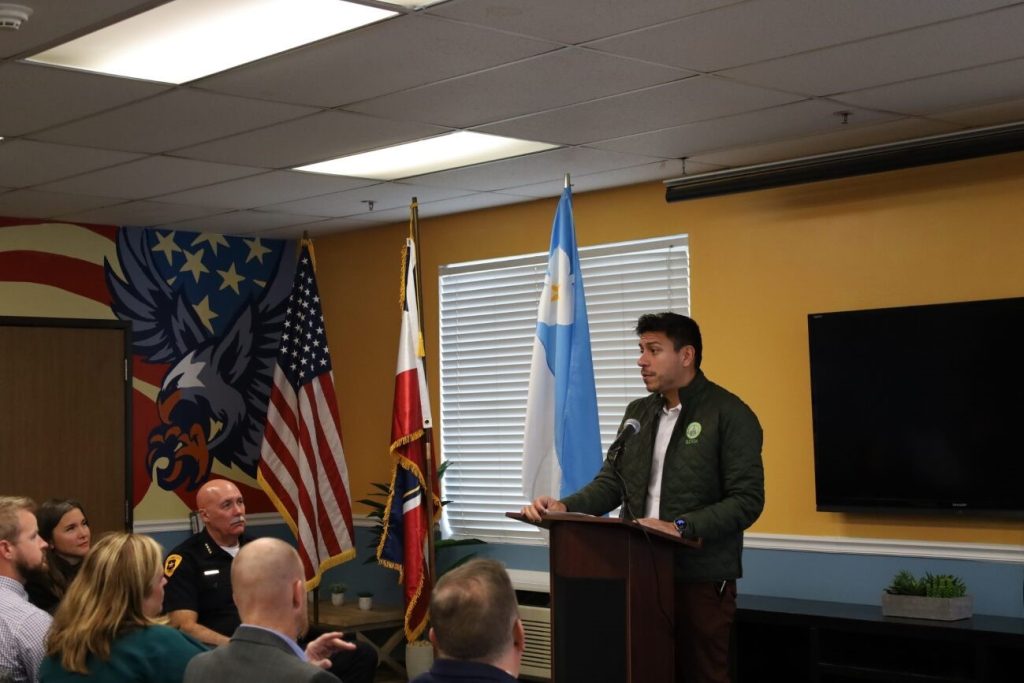 Council Member Puy addresses a room of people at a Veterans Day event recognizing those that served in the armed forces.