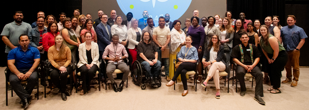 Group picture at Immigrant Heritage Month and World Refugee Day event at the Sorenson Black Box Theater