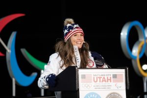 Salt Lake City Mayor Erin Mendenhall smiles as the Olympic torch is lit at Rice-Eccles Stadium at the University of Utah in honor of Salt Lake City's Olympic legacy.