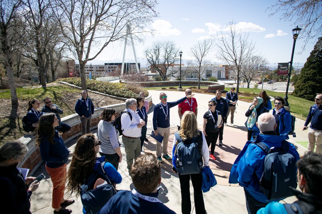 Darren Hughes of the Salt Lake City-Utah Committee for the Games gives delegates of the IOC a tour of the University of Utah campus during a site visit to Salt Lake City in April 2024.