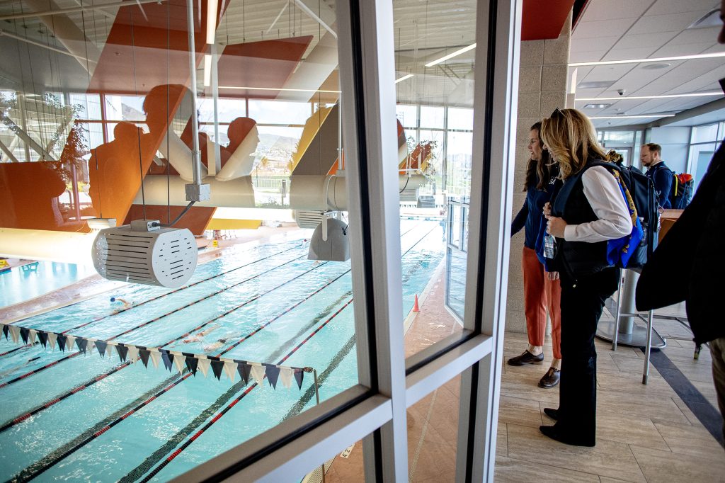 Salt Lake City Mayor Erin Mendenhall shows off the University of Utah swimming pool to the delegates of the IOC during a site visit to Salt Lake City in April 2024.
