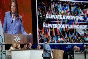 From Paris, Catherine Raney Norman gives a presentation to the International Olympic Committee in hopes of bringing the Olympic Games back to Salt Lake City.