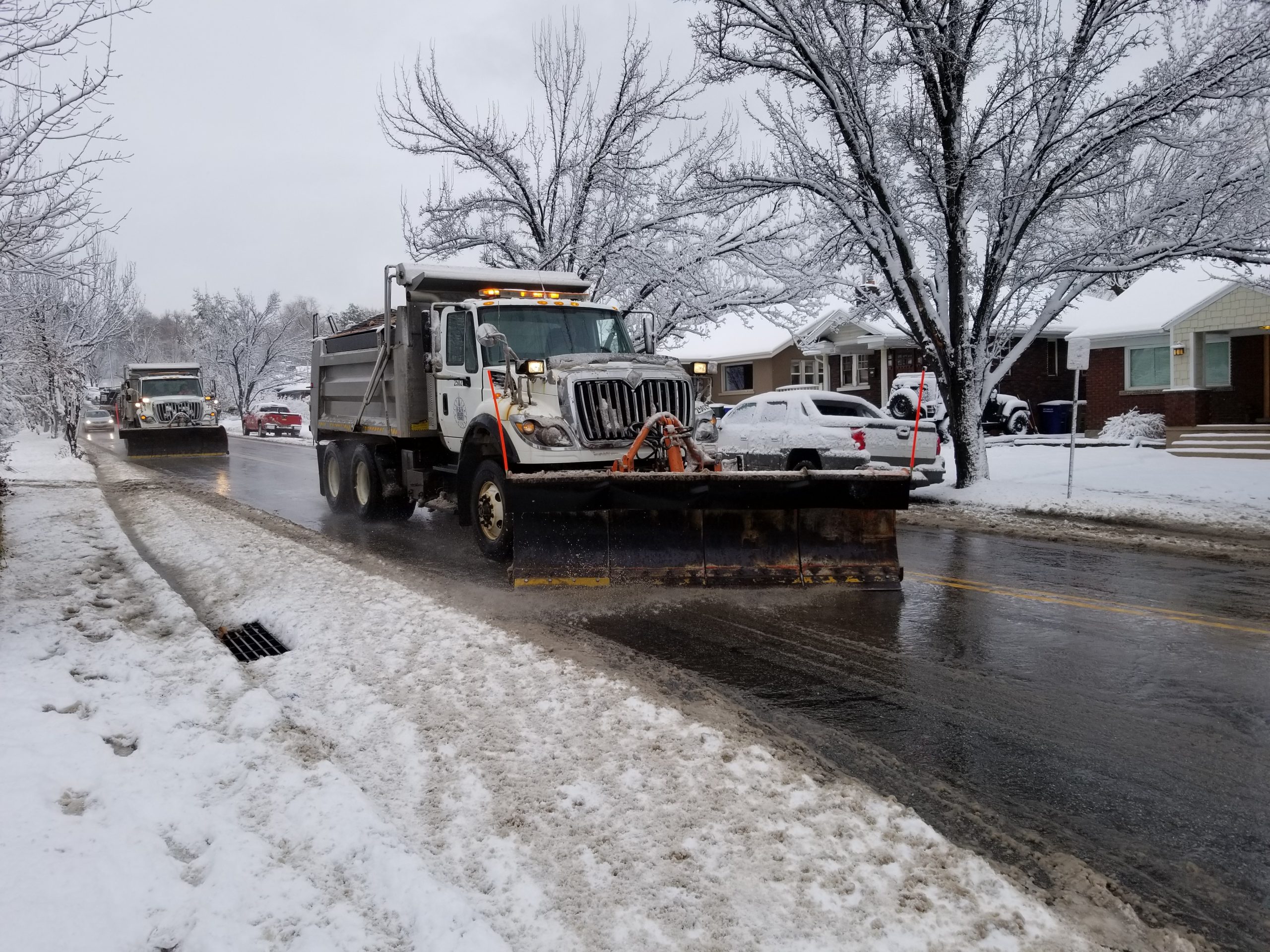 Snowplows clearing snow from roadway