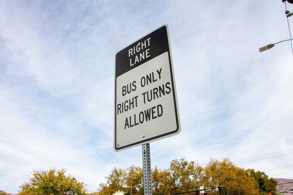 A picture of a road sign that says "Right lane. Bus only. Right turns allowed."