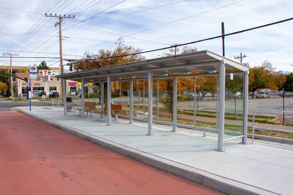 A picture of a transit shelter on a bus island.