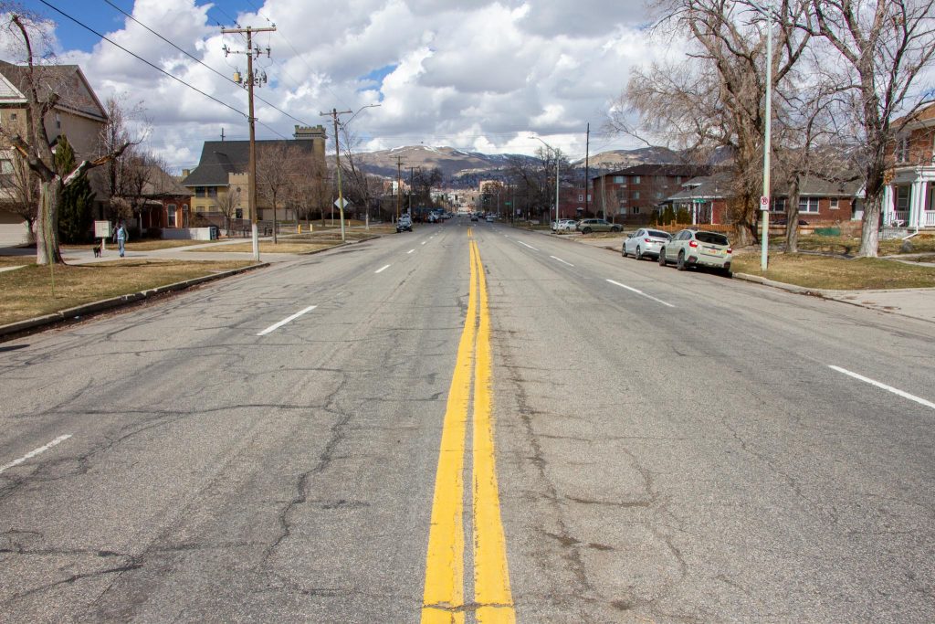 500 East looking north. A four lane road, with two vehicle travel lanes in each direction and a double yellow center line.