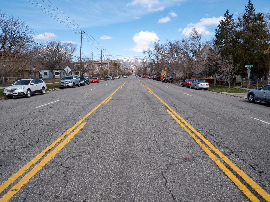 Existing conditions on 400 East looking north at Sego Avenue. The road has two travel lanes in each direction and a center two way left turn lane. 