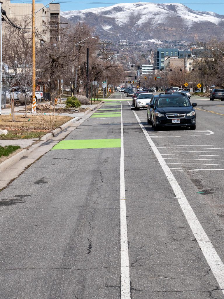 An image of the parking protected bike lane on 300 East.