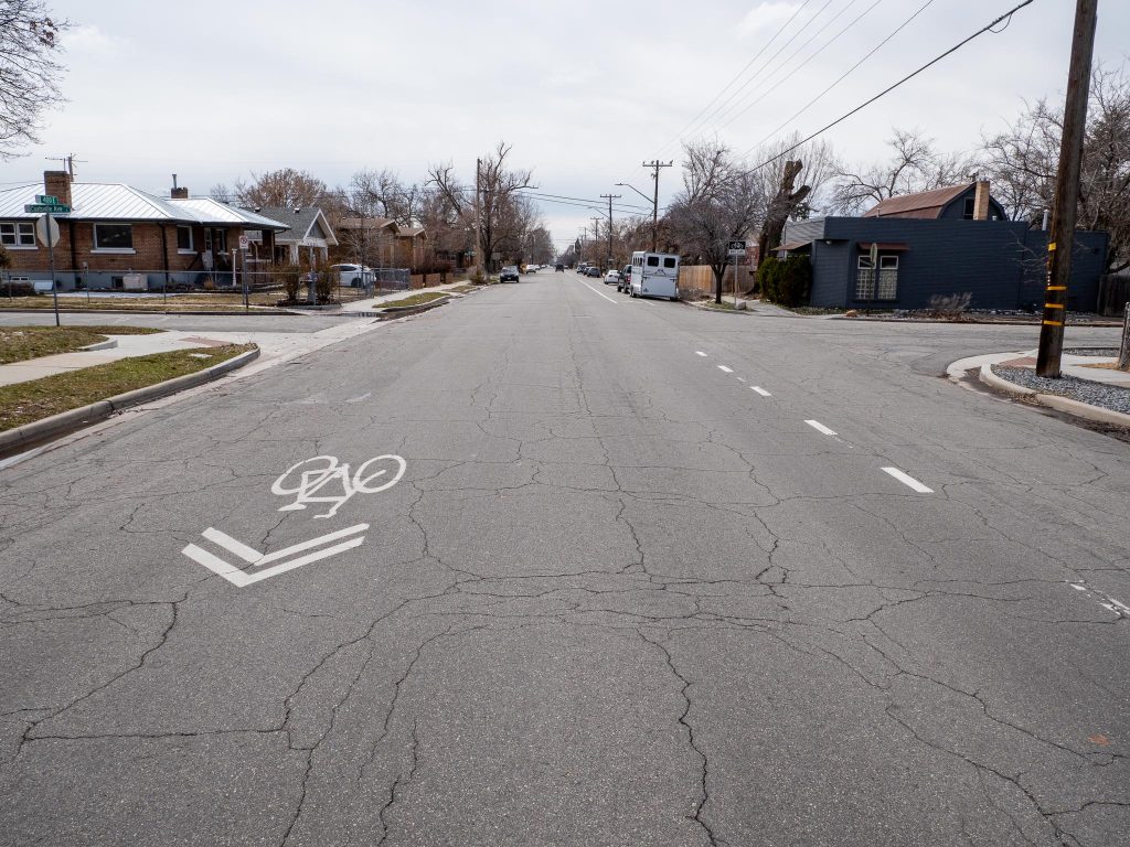 Existing conditions on 400 East looking south at Coatsville Avenue. There is no center line striping but the road does have a striped southbound bike lane and northbound sharrows.