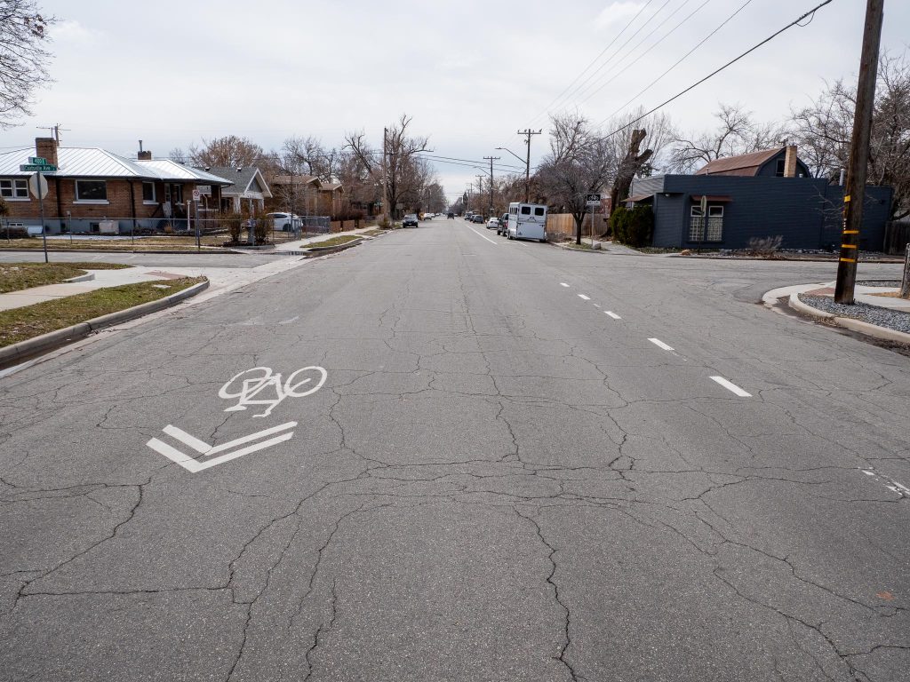 Existing conditions on 400 East looking south at Coatsville Avenue. There is no center line striping but the road does have a striped southbound bike lane and northbound sharrows. 