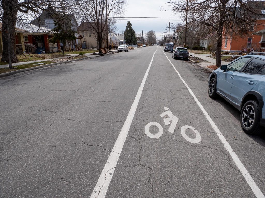 Existing conditions of 400 East looking south near Downington Ave. There is no center line striping but the road does have a striped southbound bike lane and northbound sharrows.