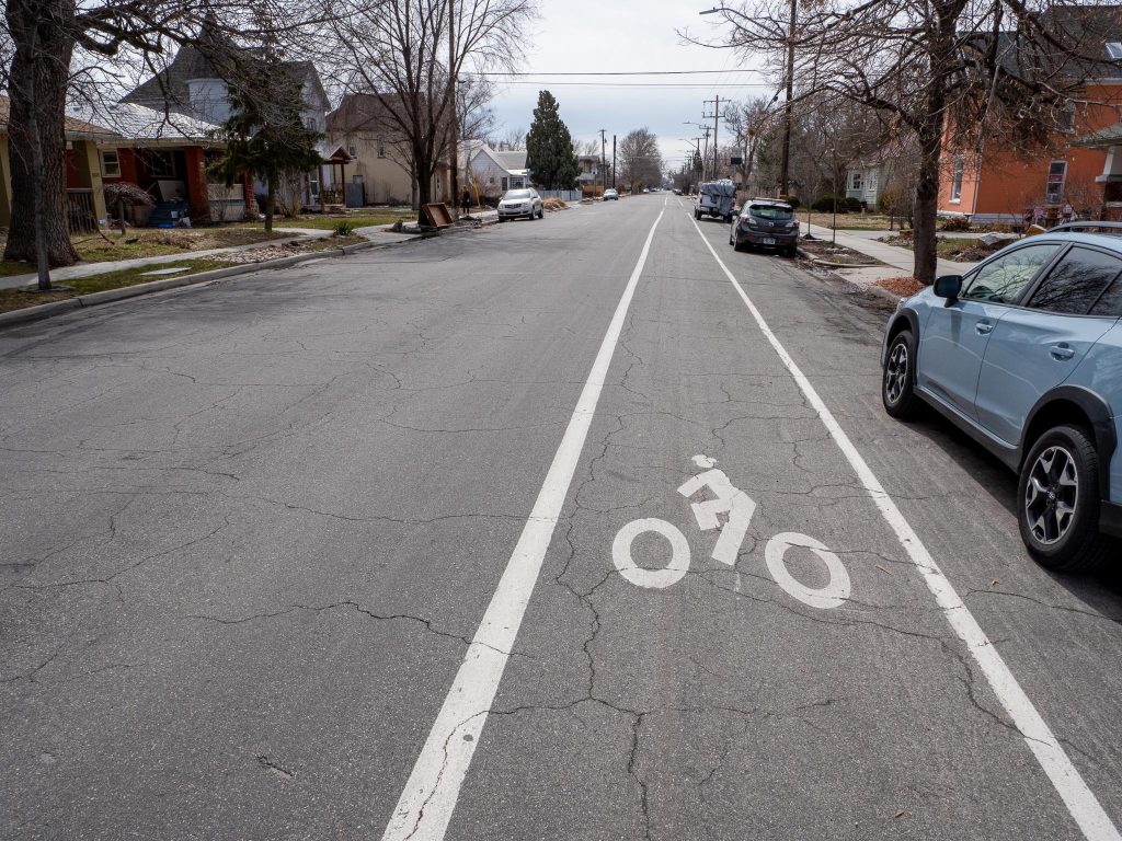 Existing conditions of 400 East looking south near Downington Ave. There is no center line striping but the road does have a striped southbound bike lane and northbound sharrows. 