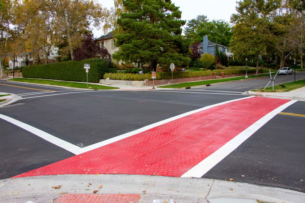 A picture of a bright red crosswalk on Virginia Street.