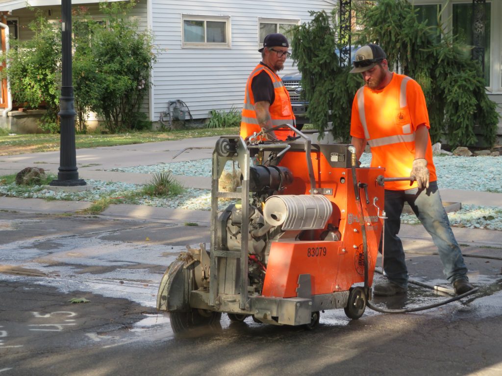 Cutting around the damaged asphalt