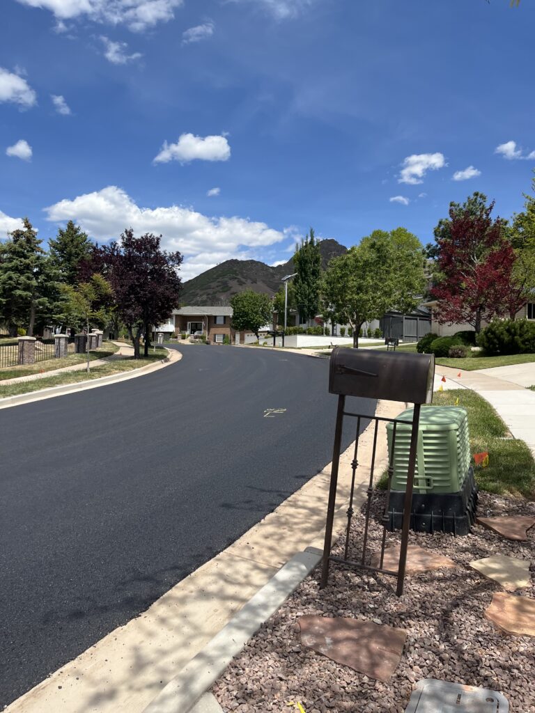Image of finished reconstruction on Chancellor Place looking northeast at the new asphalt road.