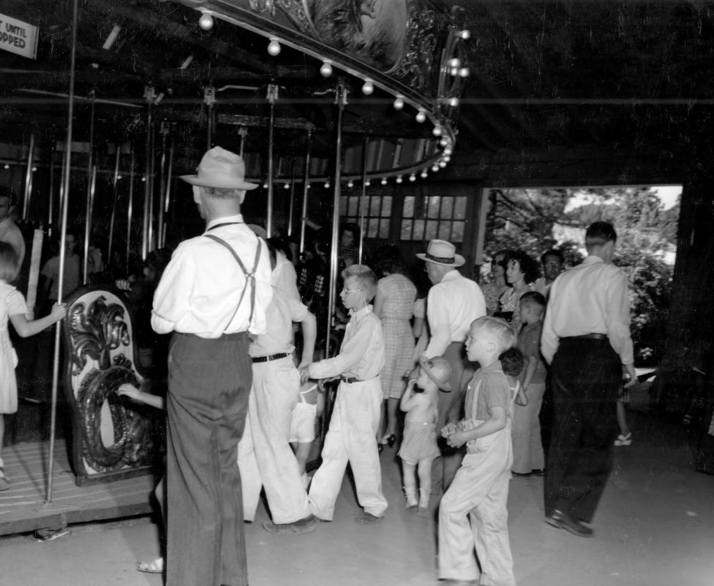 Historical black and white photo of a carousel in liberty park