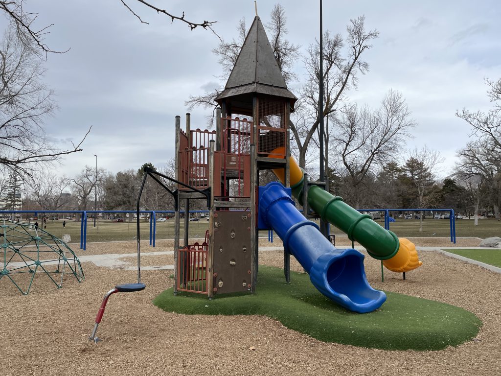Zoomed out image of Liberty Park playground slide and tower. 