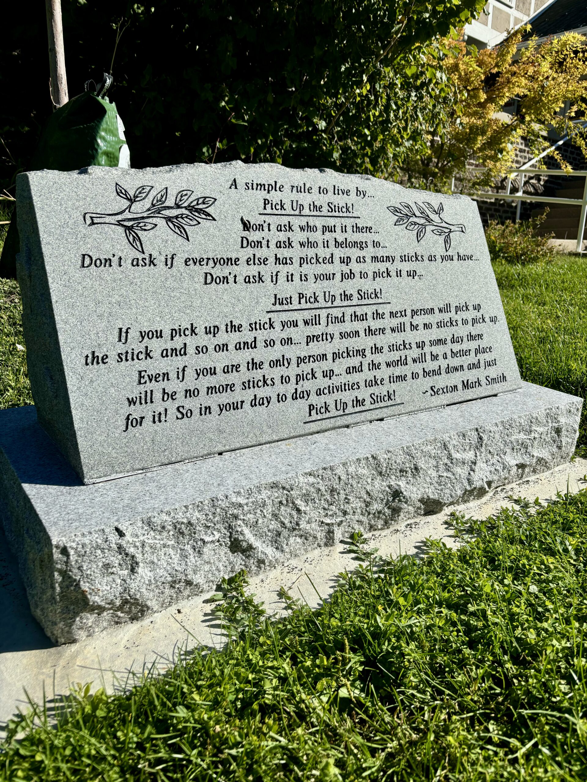 a singular grave stone with inscription. 