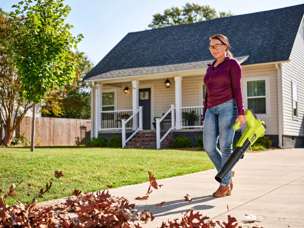 person using leaf blower