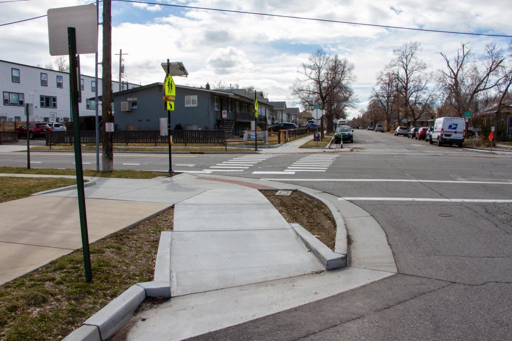 A ramp to help people riding bicycles cross 1700 East on 600 East.  