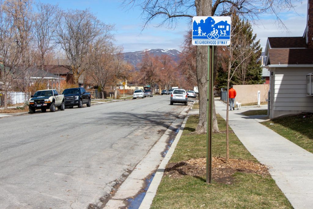 A bright blue neighborhood byway sign on 600 East used to guide people along the route. 