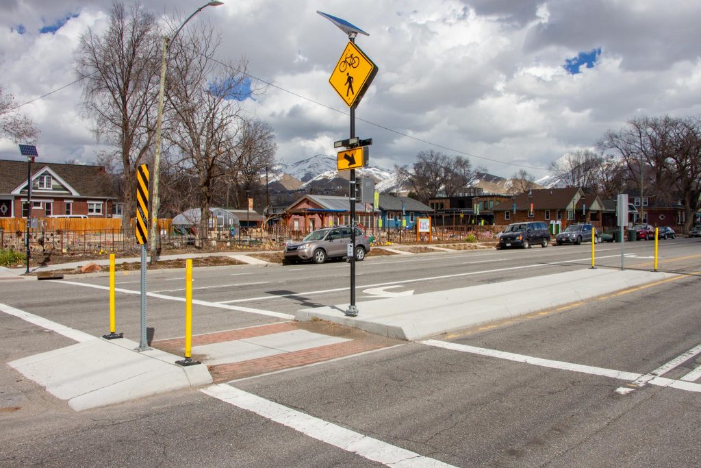 A pedestrian refuge island in the crosswalk at 600 East and 800 South