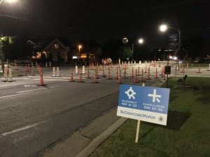 A picture of a popup roundabout at the intersection of 900 South and 1100 East at night.