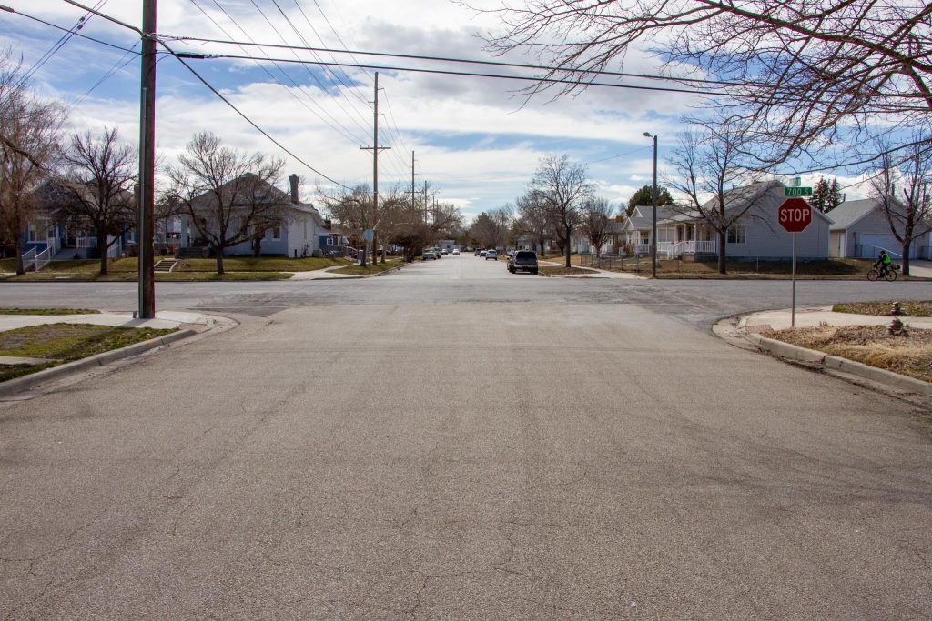 Existing conditions at the intersection of 1000 West and 700 South. A very wide street in a residential neighborhood.