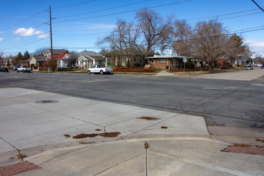 Existing conditions at the intersection of 1000 West and 700 South. A very wide street in a residential neighborhood.