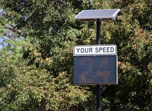 A driver feedback sign that shows a vehicle's speed of 24 miles per hour. 
