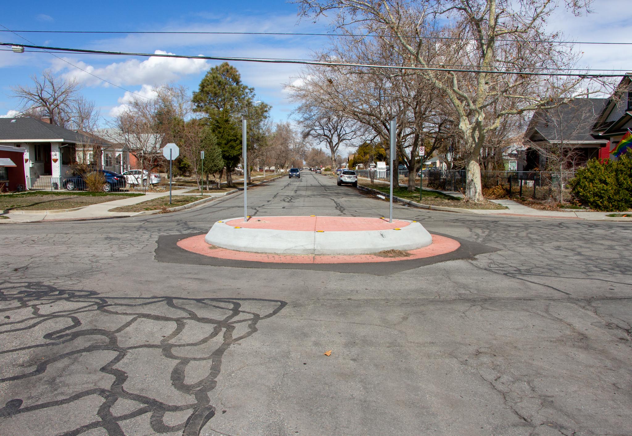 A picture of a red raised concrete traffic circle on 500 North in the Fairpark neighborhood.