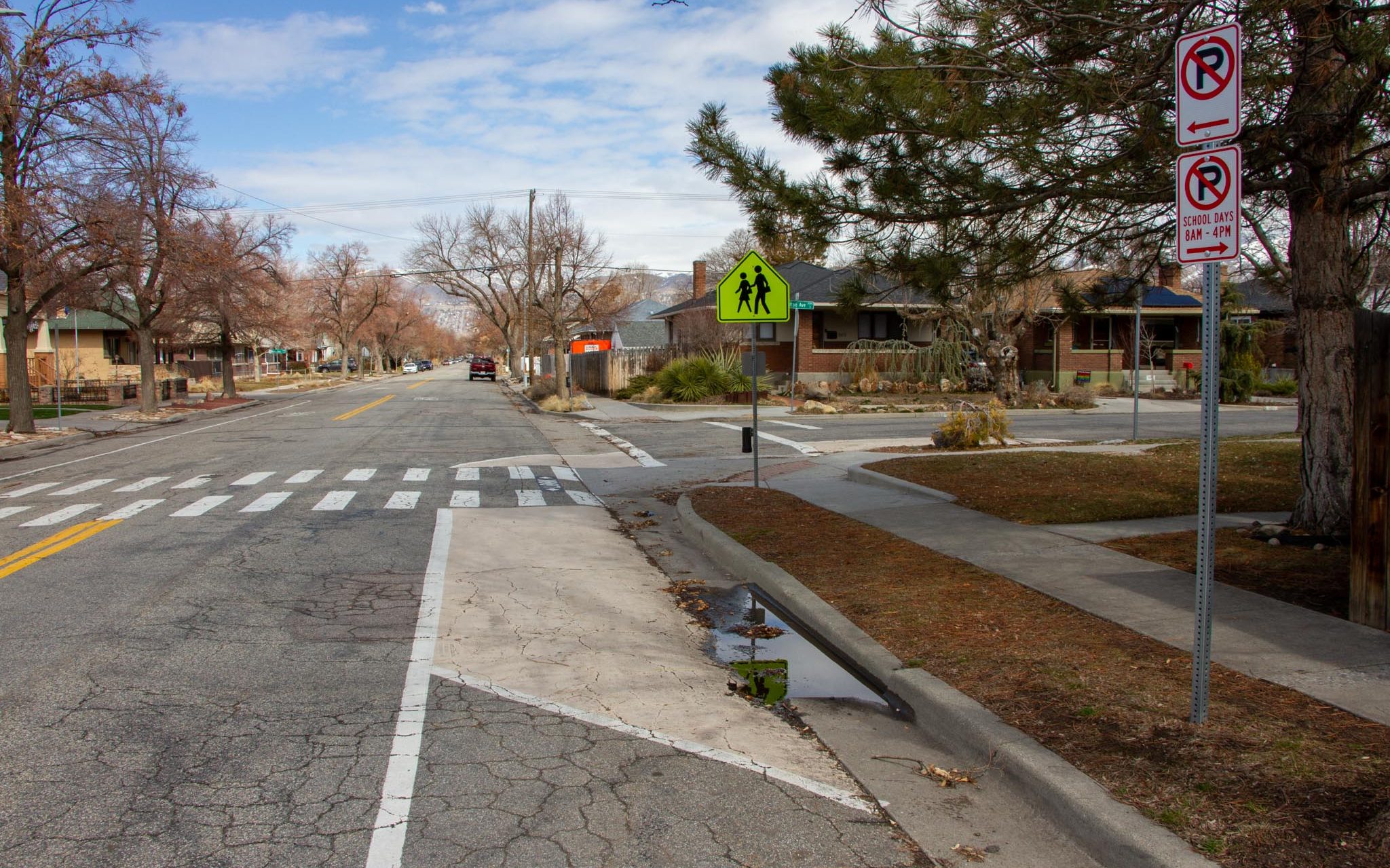 A picture of a painted curb extension near a crosswalk on 600 East.